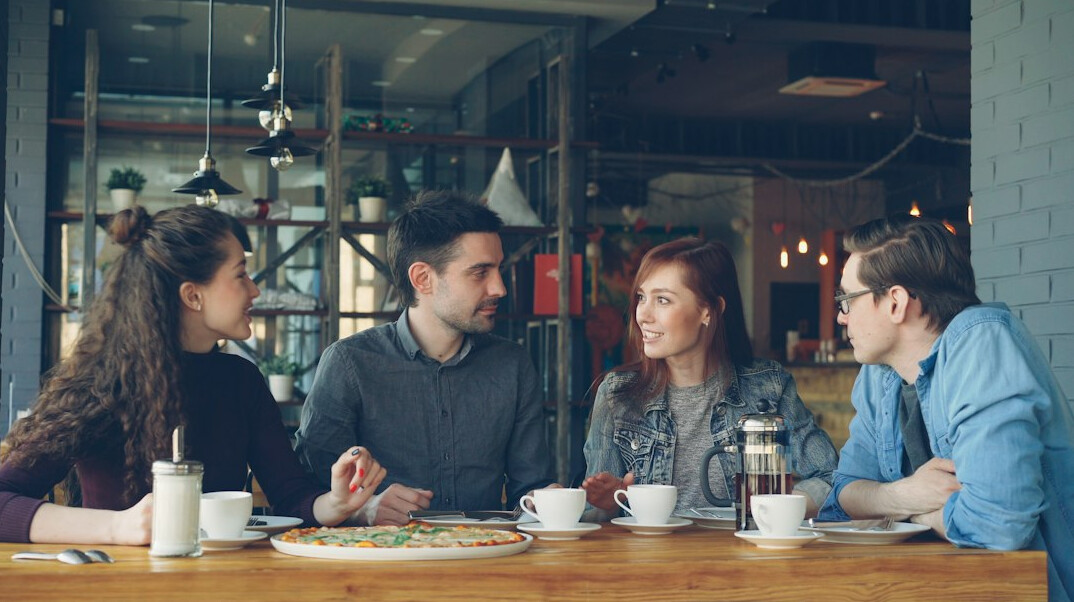 people discussing in cafe